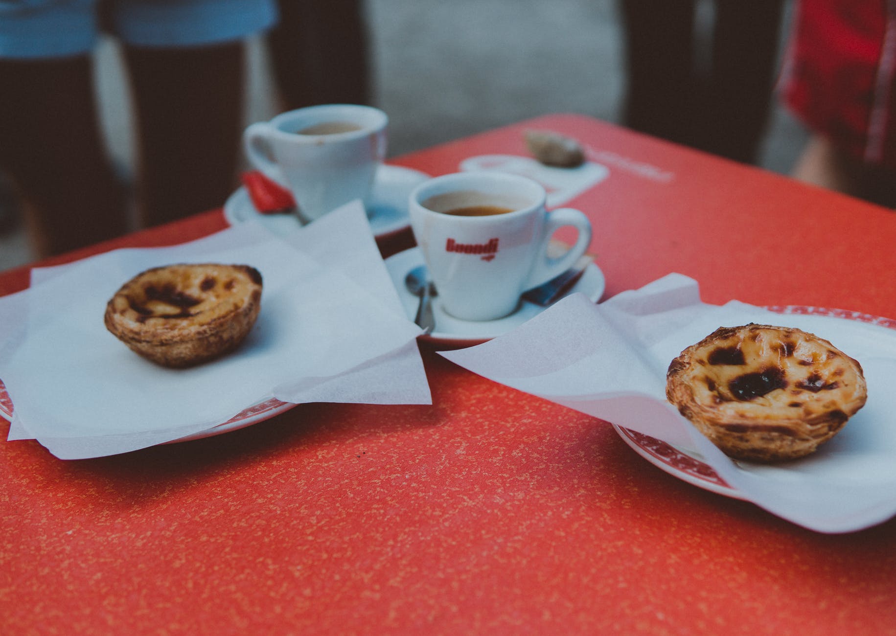 two baked pastries in plate on table